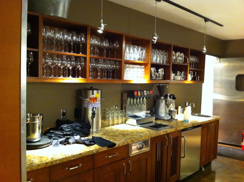 Custom millwork design for wine glass cabinet in a hotel kitchen blends style with ergonomics